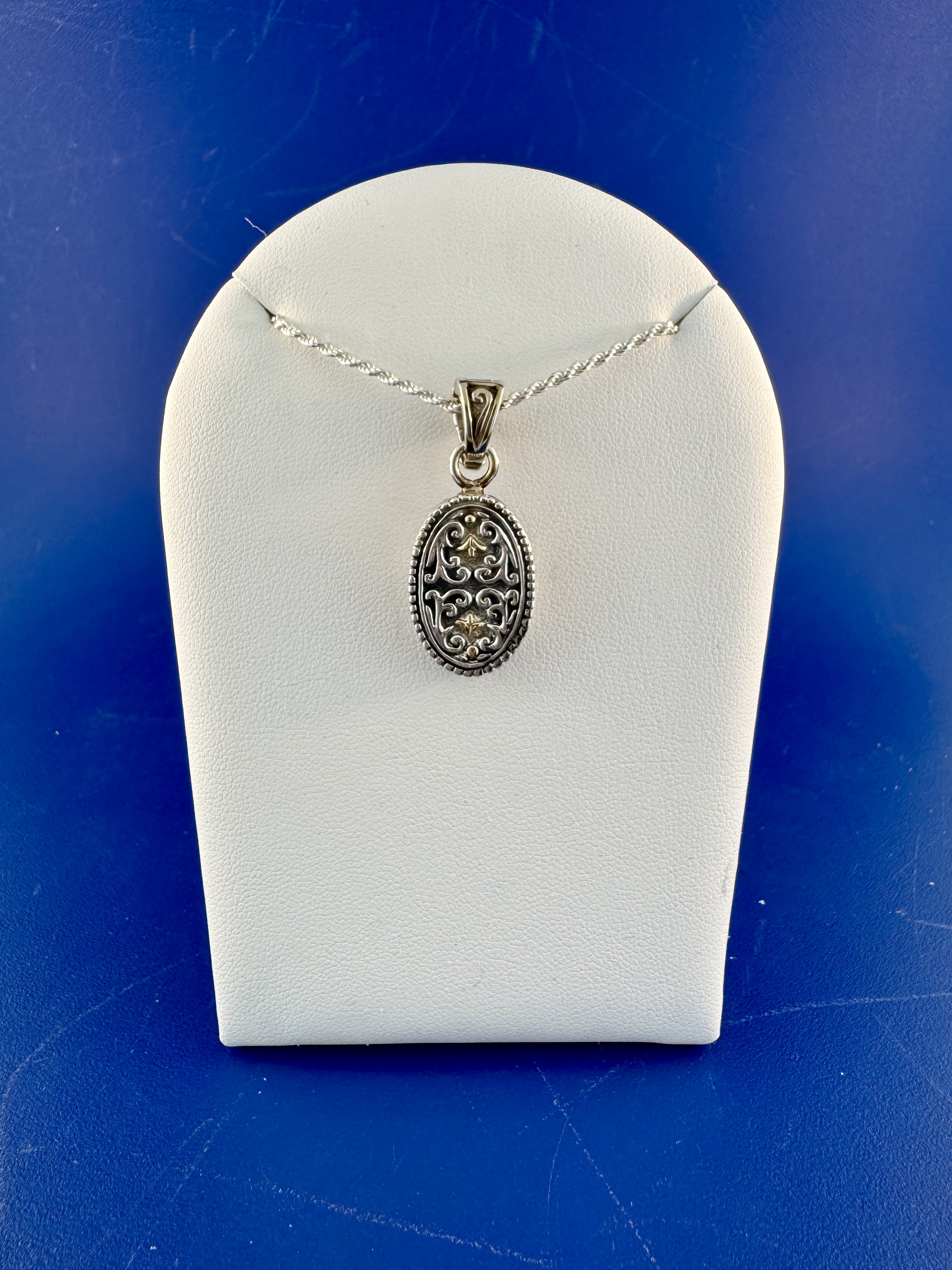 Sterling silver and 18 kt pendant