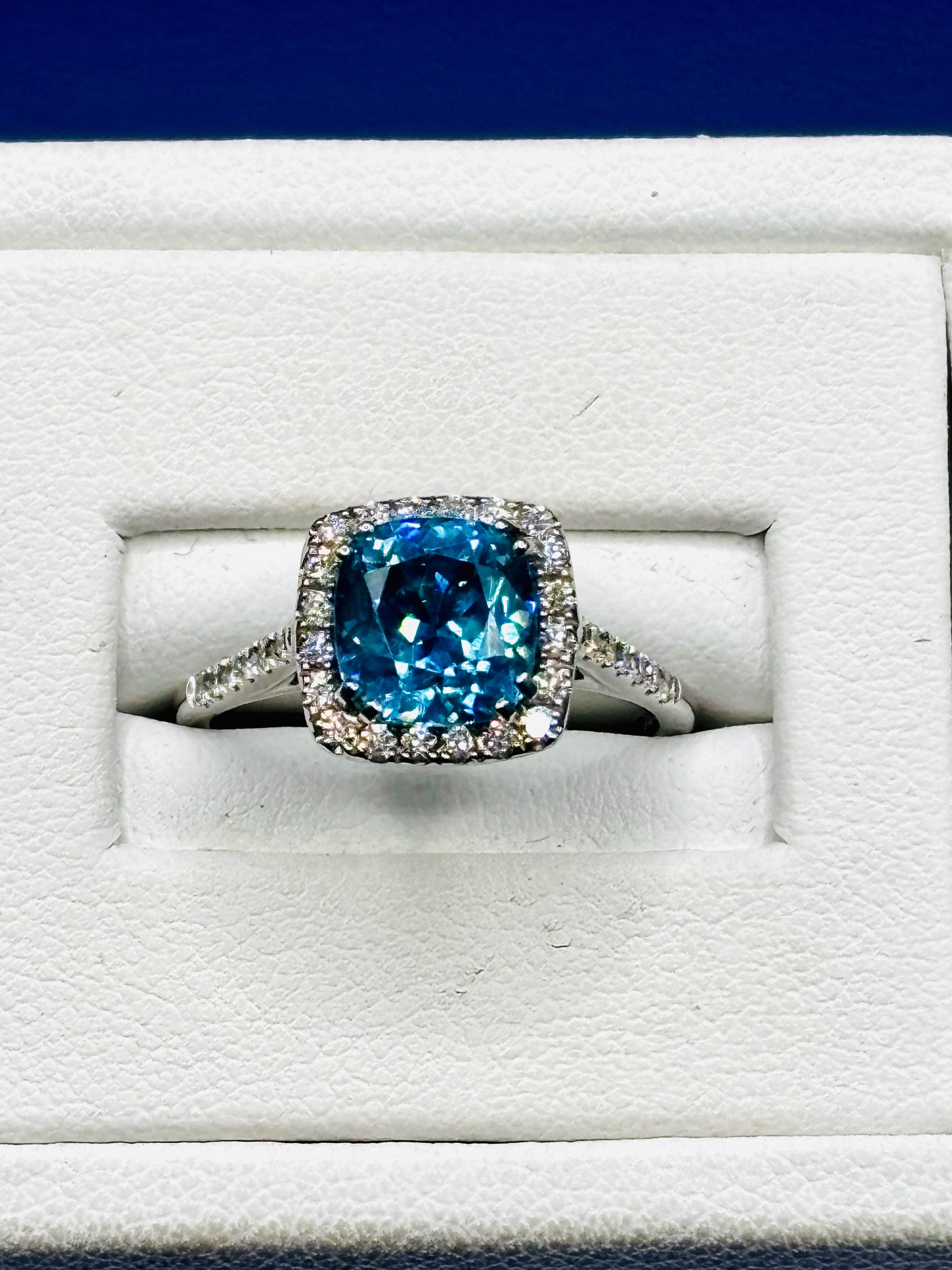 Blue Zircon &. Diamond Halo Ring