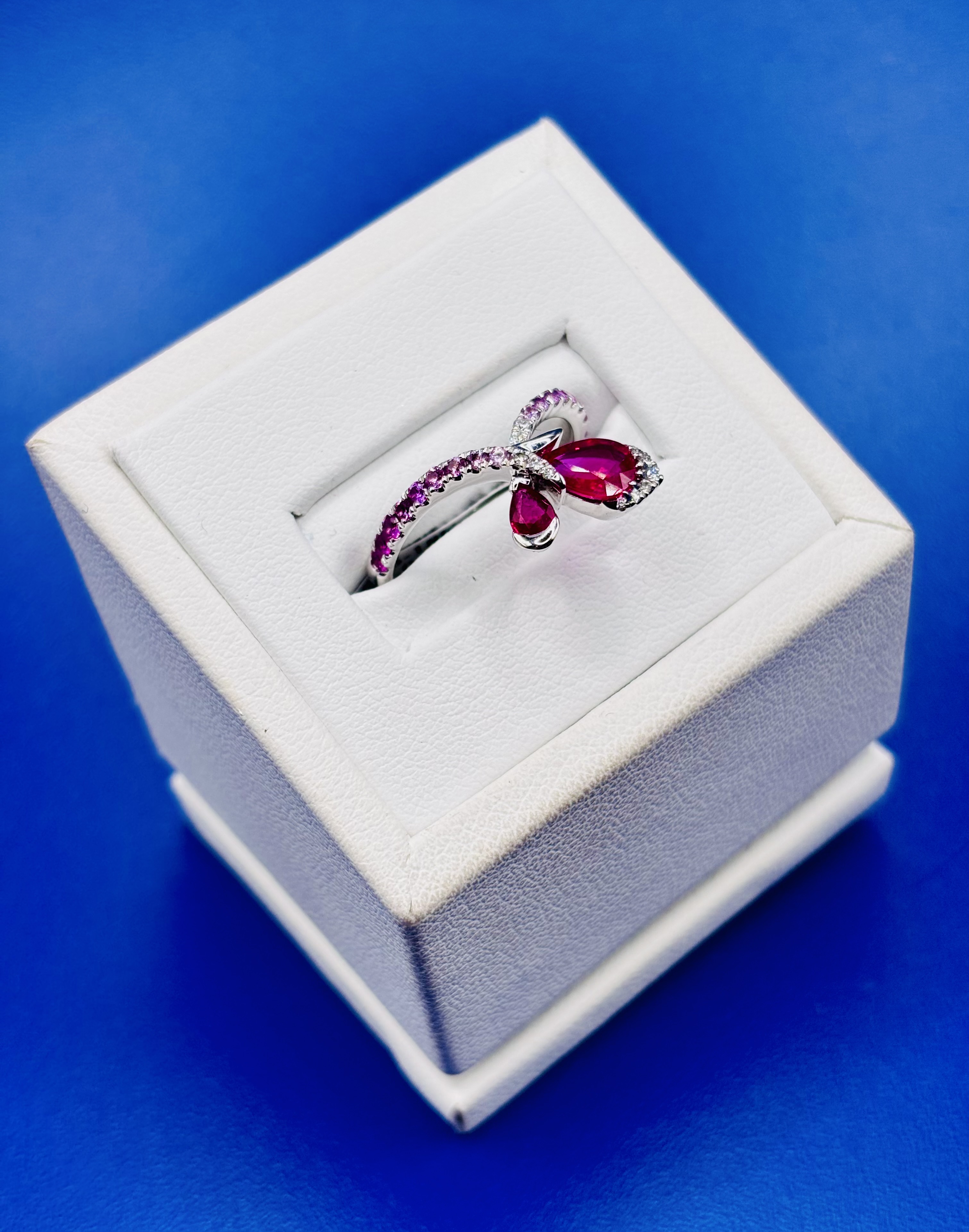 18kt White Gold Ombré Pear Shaped Ruby, Sapphire, & Diamond Band alternate view